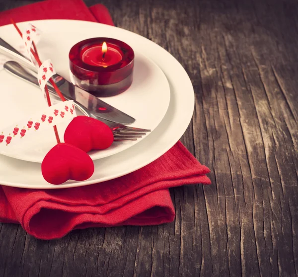 Festive table setting for Valentine's Day with fork, knife and hearts — Stock Photo, Image