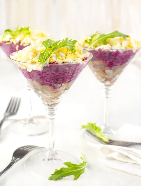 Beetroot salad with herring in a glass — Stock Photo, Image