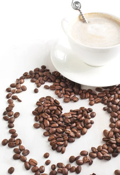 Taza de café y granos de café. —  Fotos de Stock