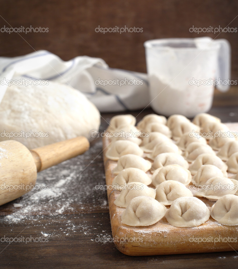 Russian traditional pelmeni with meat. Uncooked freshly made raw