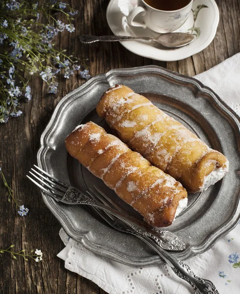 Deep-fried pastry filled with cream. Toned image — Stock Photo, Image