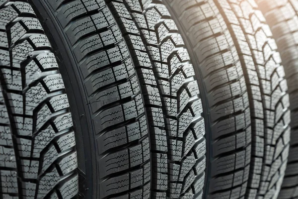 Detail of new winter tires for car with deep rubber patter to increase adhesion — Zdjęcie stockowe