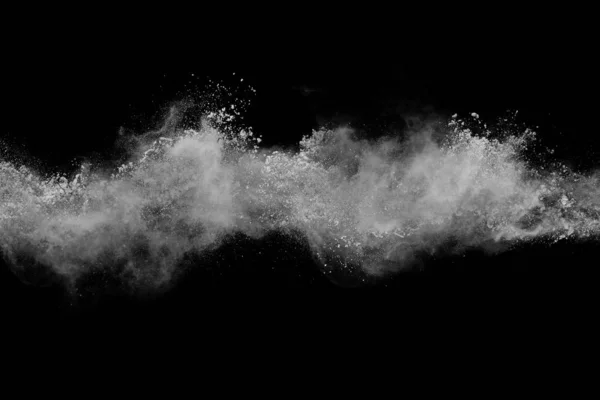 黑色背景的白色粉末爆炸 五颜六色的灰尘爆炸了 油漆Holi 免版税图库照片