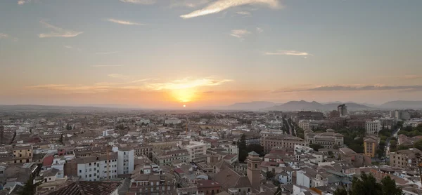 Beautiful panoramic photo overviewing the modern city of Granada at sunset. Blue cloudy sky. Andalusia. Spain. — Stock Photo, Image