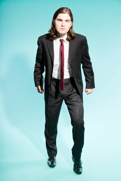 Angry frustrated business man with long brown hair. — Stock Photo, Image