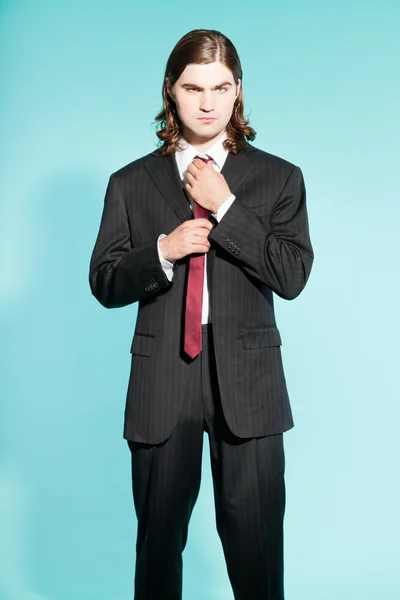 Cool business man with long brown hair confident looking. — Stock Photo, Image