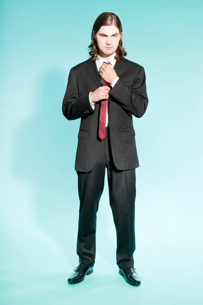 Cool business man with long brown hair confident looking. — Stock Photo, Image