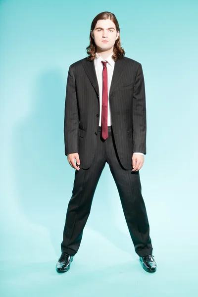 Cool business man with long brown hair confident looking. — Stock Photo, Image