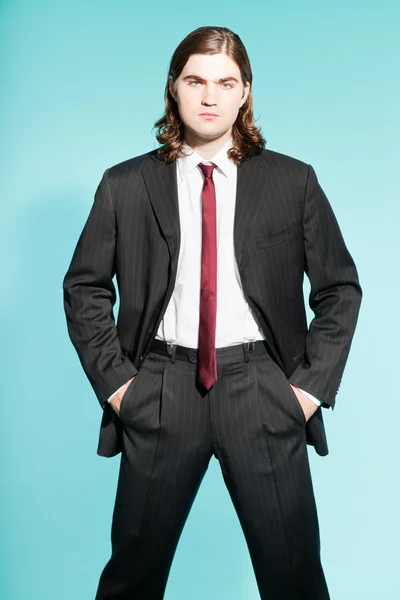 Cool business man with long brown hair confident looking. — Stock Photo, Image