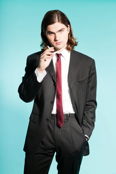 Cool business man with long brown hair confident looking. — Stock Photo, Image