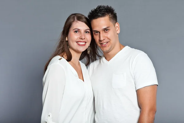 Diverse young happy couple together. Dressed in white. — Stock Photo, Image