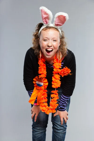 Happy funny teenage girl with curly blonde hair. — Stock Photo, Image