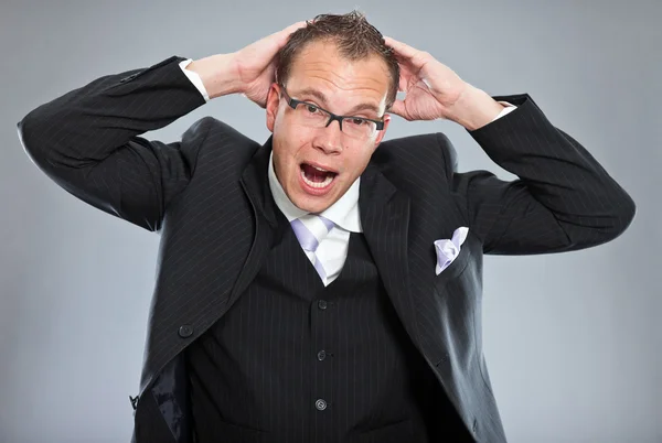 Angry confused screaming young business man — Stock Photo, Image