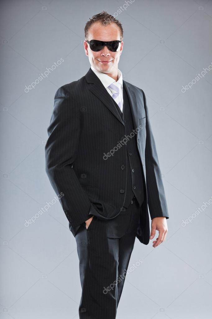 Happy Young Business Man With Short Hair Wearing Dark Suit With