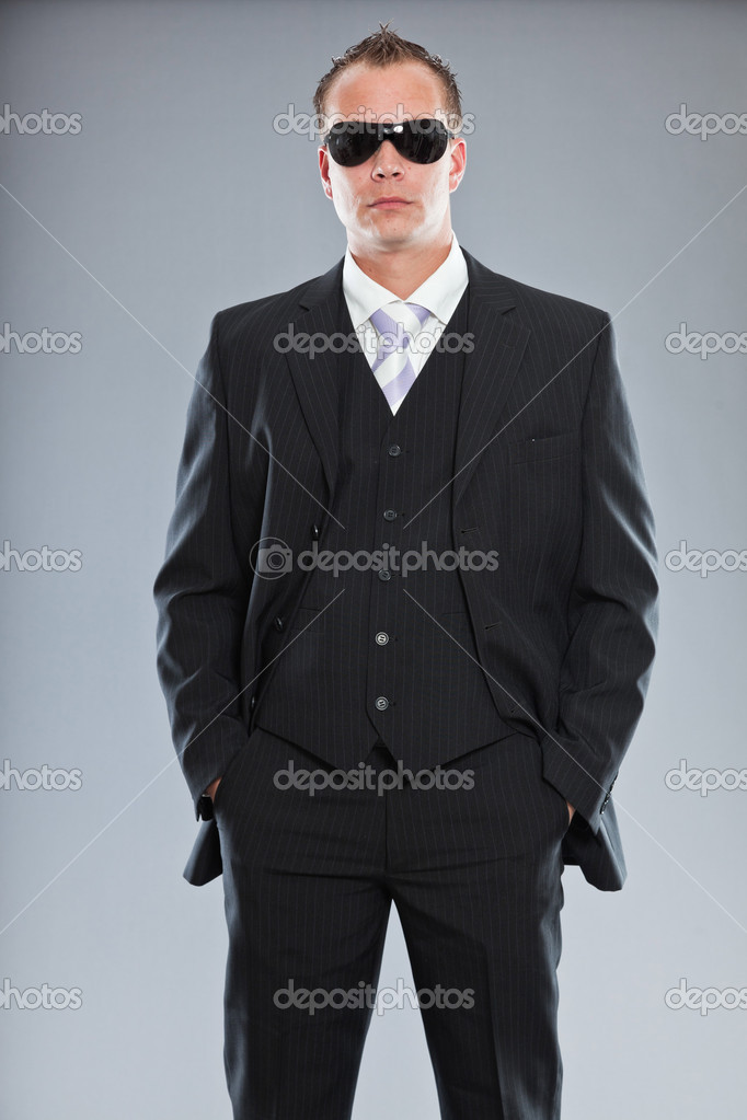 Aggressive Young Business Man With Short Hair Wearing Dark