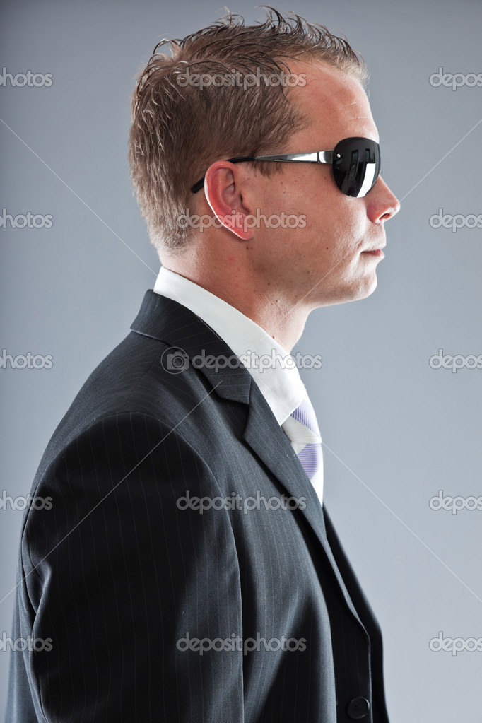 Happy Young Business Man With Short Hair Wearing Dark Suit