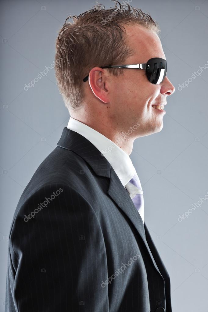 Happy Young Business Man With Short Hair Wearing Dark Suit With