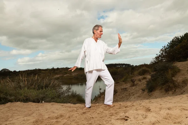 Senior spiritual man dressed in white. — Stock Photo, Image