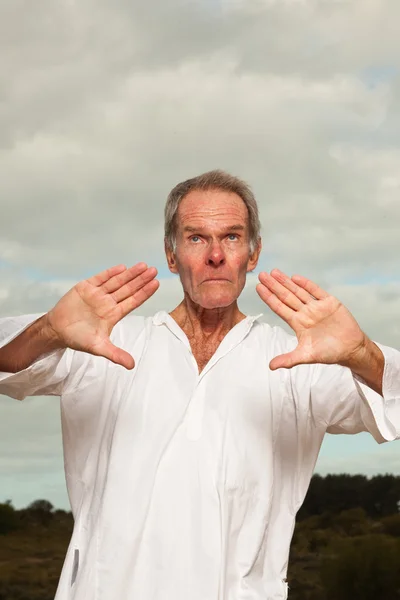 Senior spiritual man dressed in white. — Stock Photo, Image