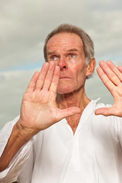 Senior spiritual man dressed in white. — Stock Photo, Image