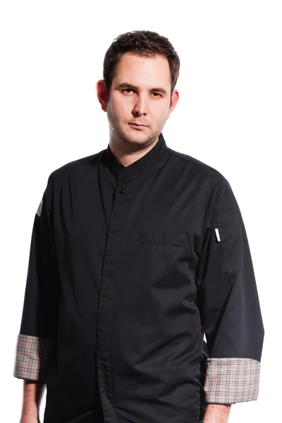 Young male cook with black cooks jacket. — Stock Photo, Image