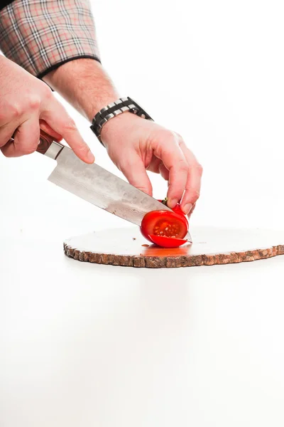 Cook cutting tomatoes. — Stock Photo, Image