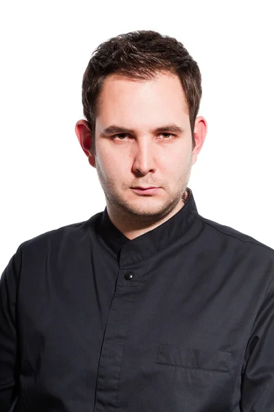 Joven cocinero masculino con chaqueta de cocinero negro . — Foto de Stock