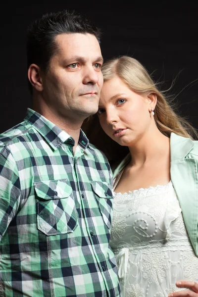 Couple in love. Studio shot against black. — Stock Photo, Image