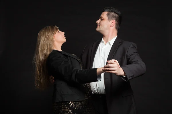 Couple in love. Studio shot against black. — Stock Photo, Image