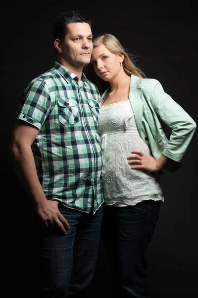 Couple in love. Studio shot against black. — Stock Photo, Image