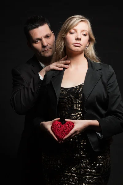 Couple in love. Studio shot against black. — Stock Photo, Image