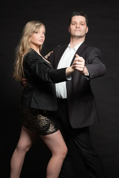 Couple in love. Studio shot against black. — Stock Photo, Image