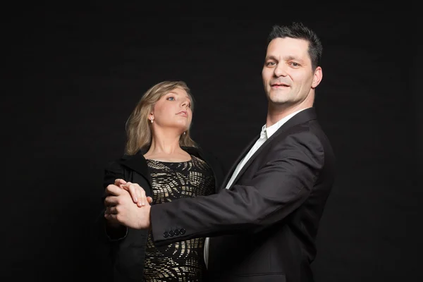 Couple in love. Studio shot against black. — Stock Photo, Image