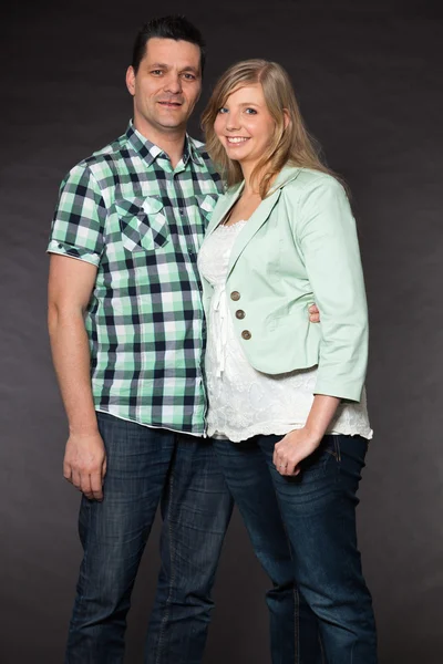 Couple in love. Studio shot against black. — Stock Photo, Image