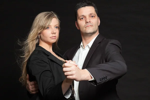 Couple in love. Studio shot against black. — Stock Photo, Image