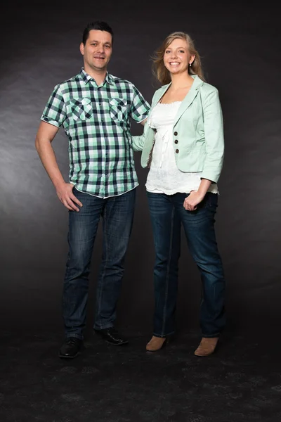 Couple in love. Studio shot against black. — Stock Photo, Image