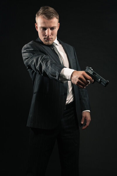 Mafia man with gun.