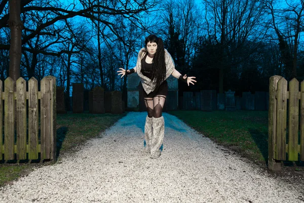 Gothic girl at cemetery. — Stock Photo, Image