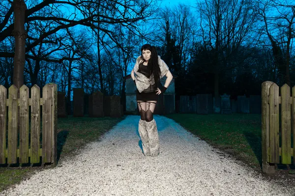 Gothic girl at cemetery. — Stock Photo, Image