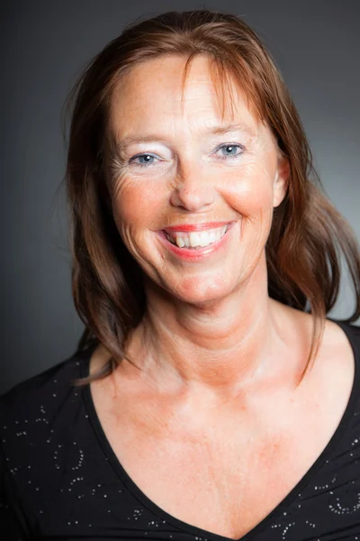 Middle aged woman with long brown hair. — Stock Photo, Image