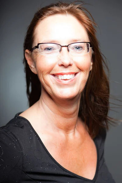 Middle aged woman with long brown hair. — Stock Photo, Image