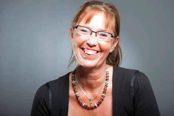 Middle aged woman with long brown hair. — Stock Photo, Image