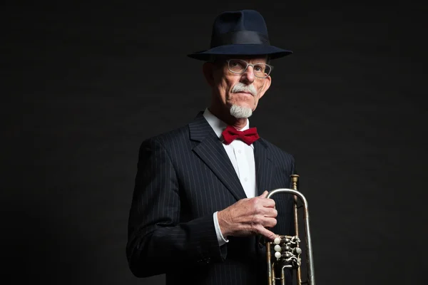 Studio portrait of active senior well dressed retired man. — Stock Photo, Image