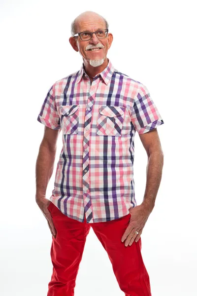 Studio portret van actieve senior goed gekleed gepensioneerde man. — Stockfoto