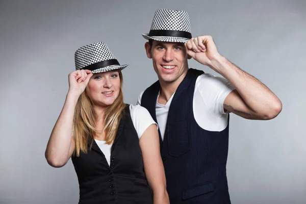 Happy young couple man and woman in love. Wearing hat. — Stock Photo, Image