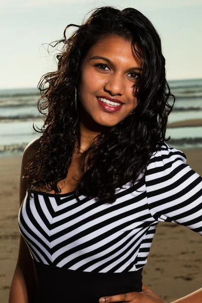 Pretty indian girl with long hair on the beach in summer. — Stock Photo, Image