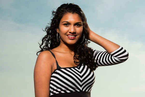 Pretty indian girl with long hair on the beach in summer. — Stock Photo, Image