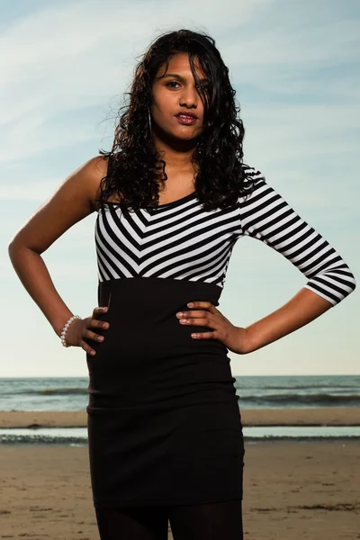 Pretty indian girl with long hair on the beach in summer. — Stock Photo, Image