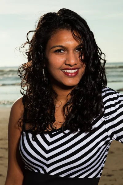 Pretty indian girl with long hair on the beach in summer. — Stock Photo, Image