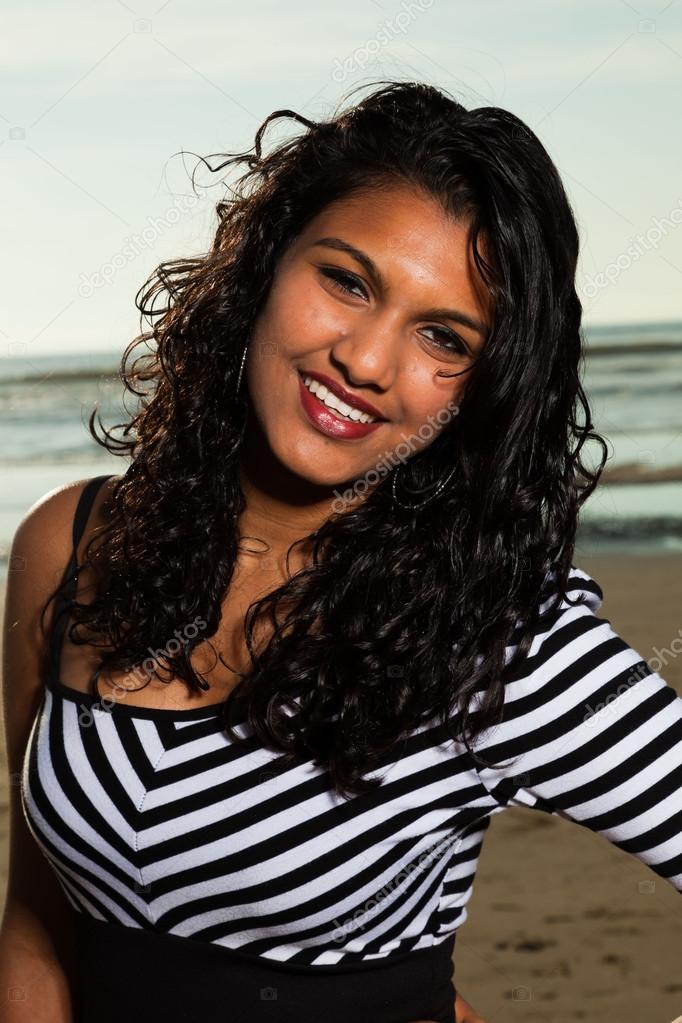 Pretty indian girl with long hair on the beach in summer. Stock Photo by ©ysbrand 20179917 Pretty indian girl with long hair on the beach in summer. Stock Photo by ©ysbrand 20179917